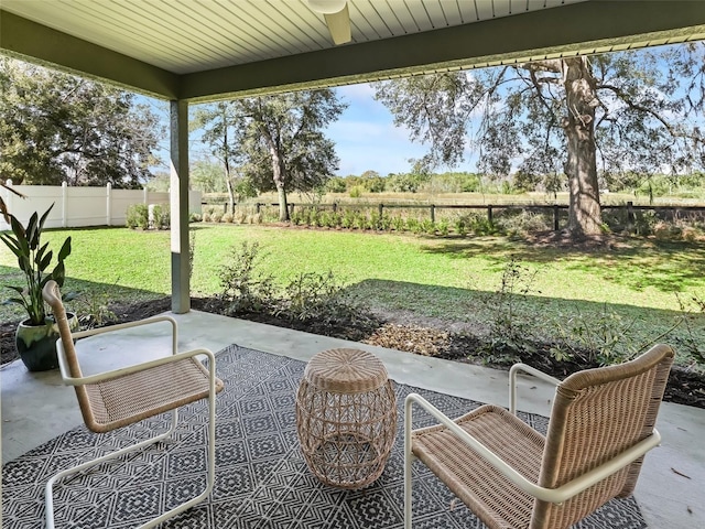 view of patio / terrace featuring a rural view and ceiling fan