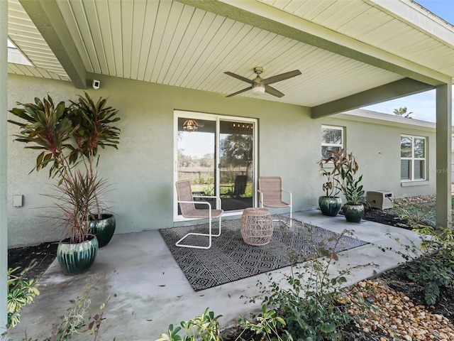 view of patio featuring ceiling fan