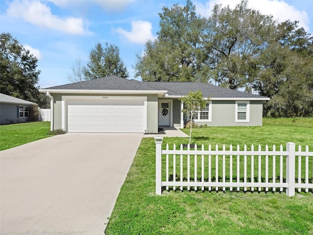 single story home with a garage and a front lawn