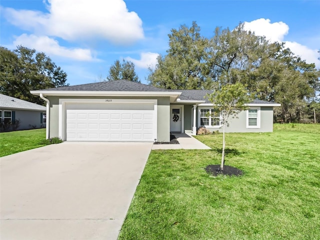 ranch-style house with a garage and a front lawn