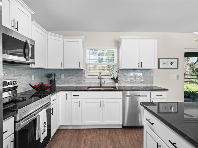 14605 SW 20th Pl, Ocala, FL 34481 - kitchen featuring dark wood finished floors, white cabinetry, a sink, and appliances with stainless steel finishes