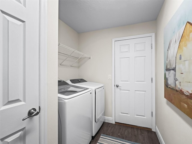 14605 SW 20th Pl, Ocala, FL 34481 - clothes washing area with separate washer and dryer, dark wood-type flooring, baseboards, and laundry area