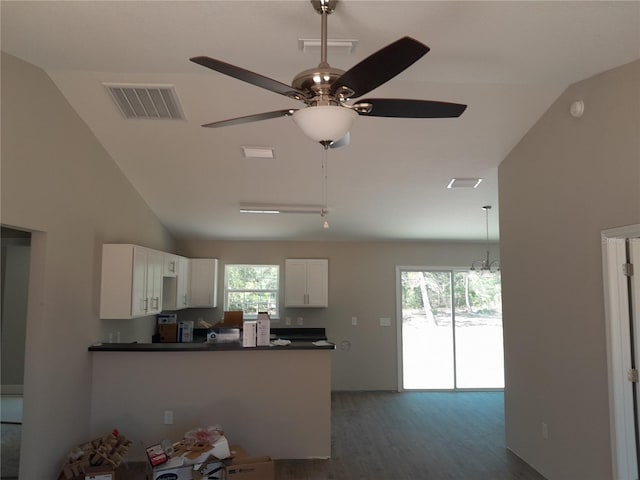 46 Malauka Dr, Ocklawaha, FL 32179 - kitchen featuring dark wood finished floors, dark countertops, white cabinetry, and visible vents