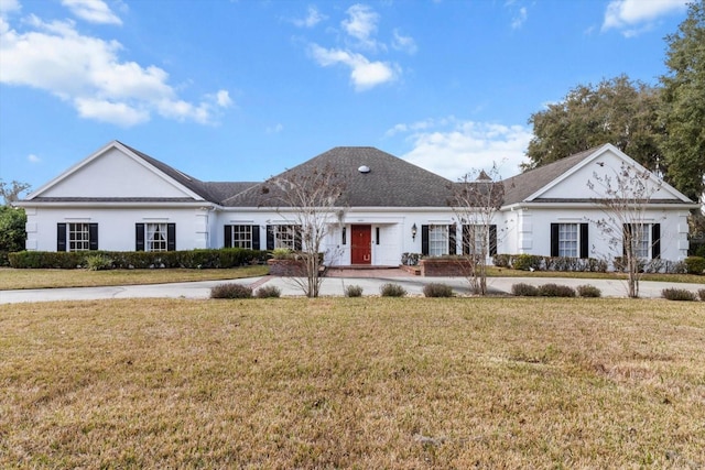 ranch-style house featuring a front lawn