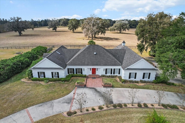 birds eye view of property with a rural view