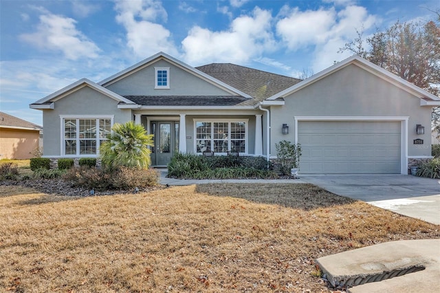 ranch-style house featuring a garage and a front lawn