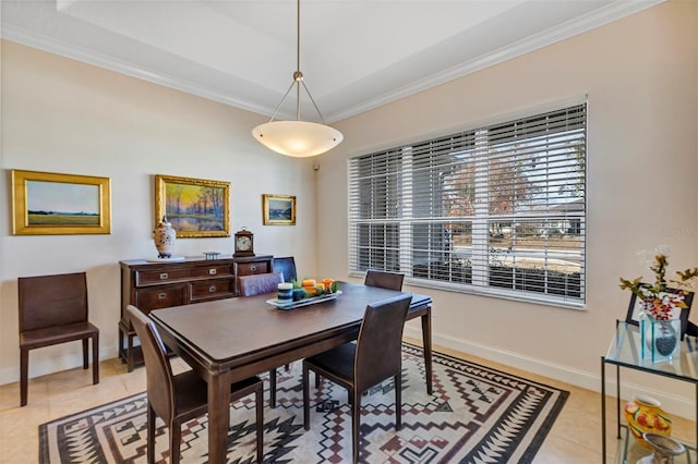 dining space with light tile patterned floors and ornamental molding