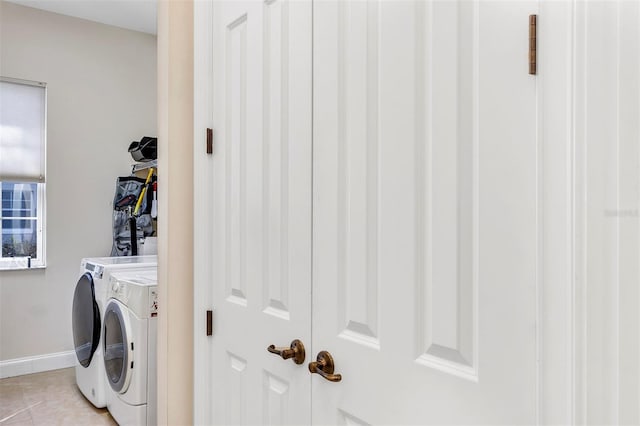 washroom with light tile patterned flooring and separate washer and dryer