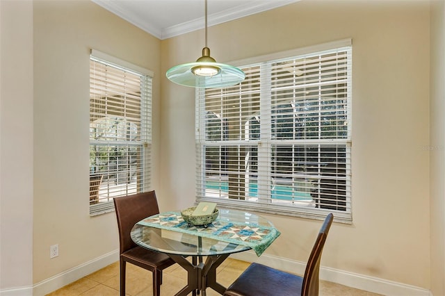 dining area featuring light tile patterned flooring and ornamental molding