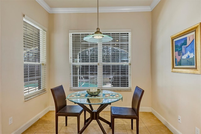 tiled dining area featuring crown molding