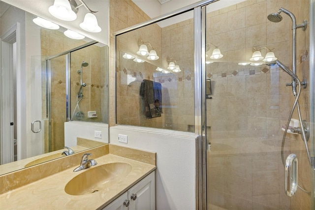 bathroom with an enclosed shower and vanity