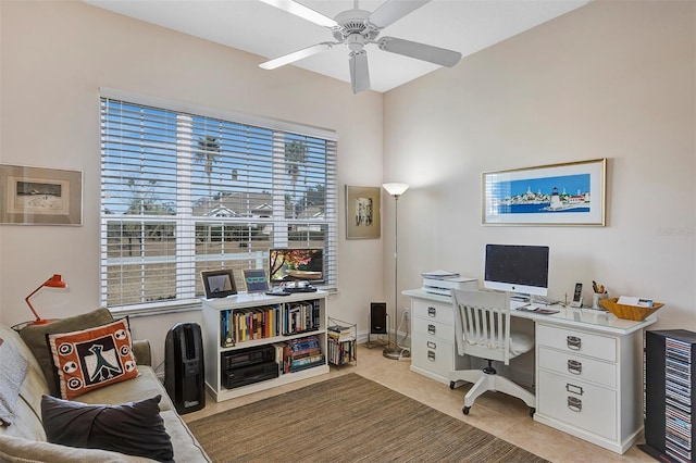 office area with light tile patterned flooring and ceiling fan