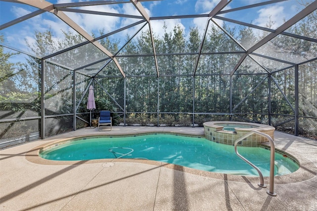 view of pool with an in ground hot tub, a lanai, and a patio area