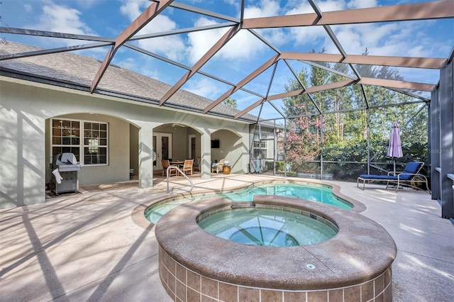 view of pool featuring an in ground hot tub, grilling area, a lanai, and a patio area