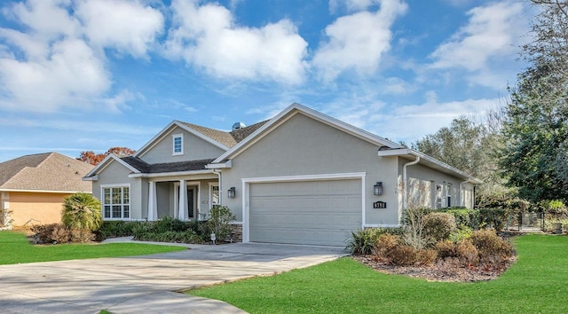 view of front of property with stucco siding, driveway, a garage, and a front lawn