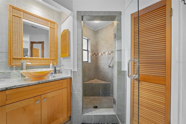 bathroom featuring vanity and walk in shower