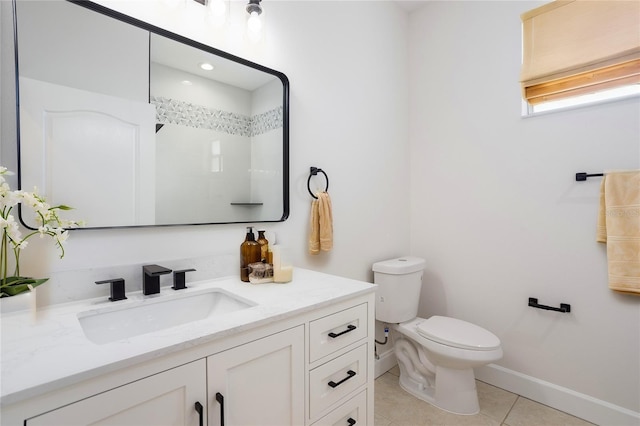 full bathroom with tile patterned floors, toilet, vanity, and baseboards