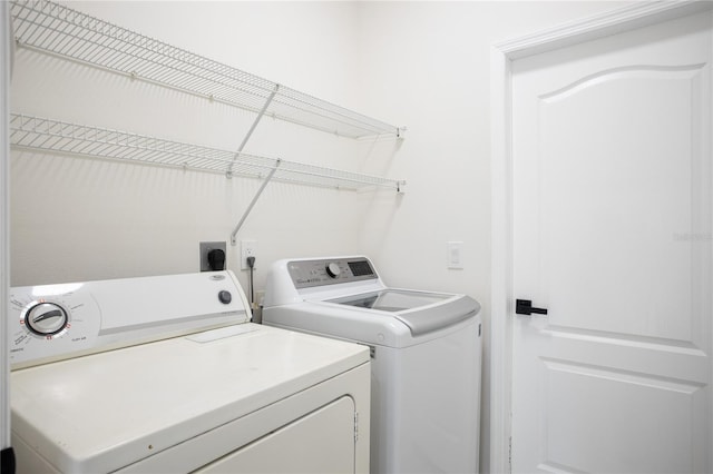 clothes washing area with laundry area and washing machine and dryer