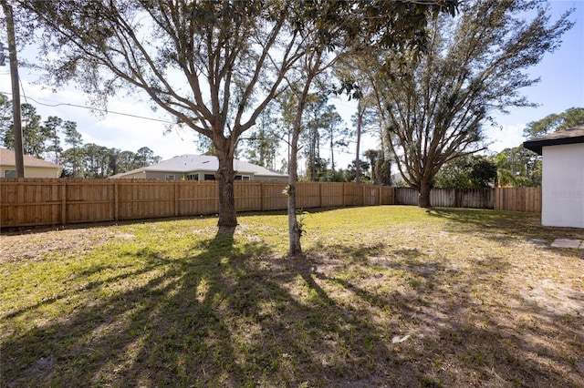 view of yard featuring a fenced backyard