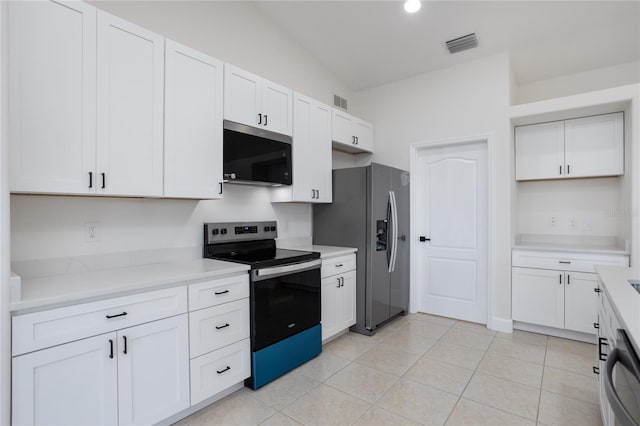 kitchen featuring light tile patterned floors, visible vents, stainless steel appliances, and light countertops