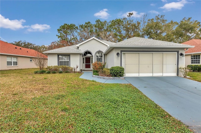 ranch-style house featuring a garage and a front yard