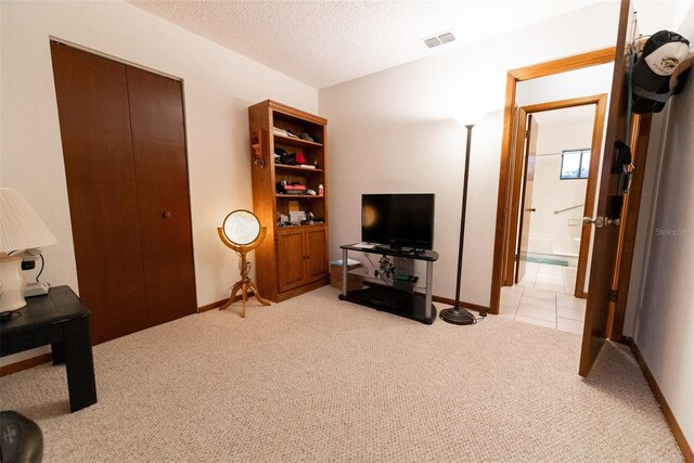 interior space with a textured ceiling