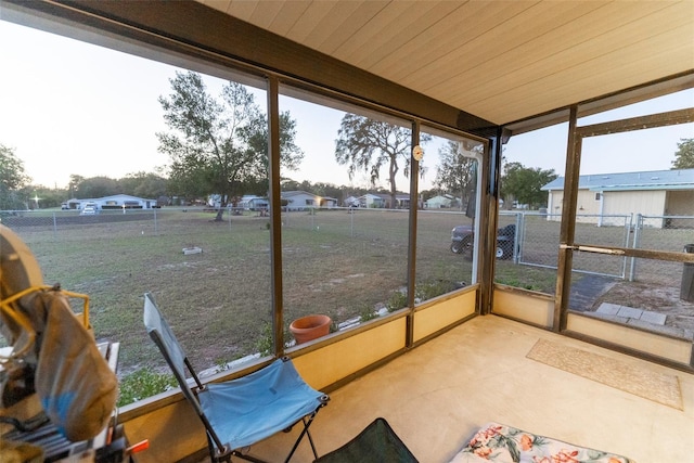unfurnished sunroom featuring wooden ceiling