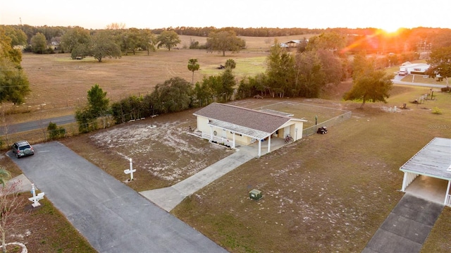 aerial view at dusk featuring a rural view