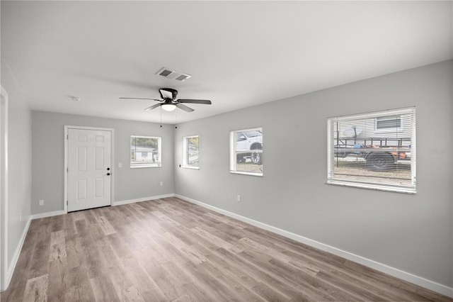 unfurnished room featuring ceiling fan and light wood-type flooring