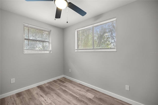 unfurnished room featuring ceiling fan and light hardwood / wood-style floors