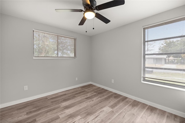 unfurnished room with ceiling fan and light wood-type flooring