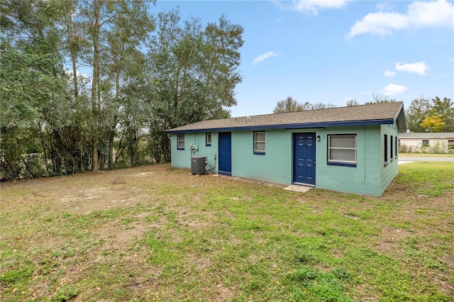 exterior space featuring a yard and central AC unit