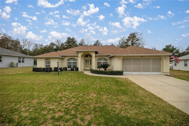 mediterranean / spanish-style home with central AC, a front yard, stucco siding, a garage, and driveway