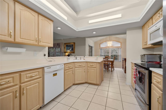 kitchen with white appliances, light brown cabinets, a peninsula, light tile patterned flooring, and light countertops