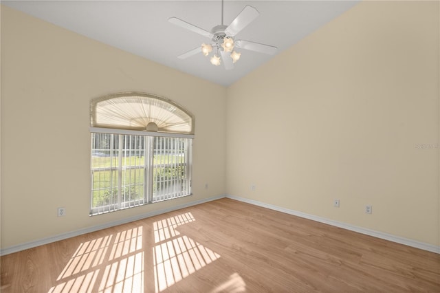 unfurnished room featuring ceiling fan, light wood finished floors, and baseboards