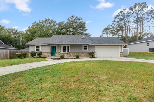 ranch-style home with a garage and a front yard