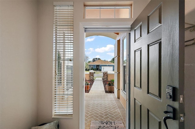 foyer entrance featuring brick floor