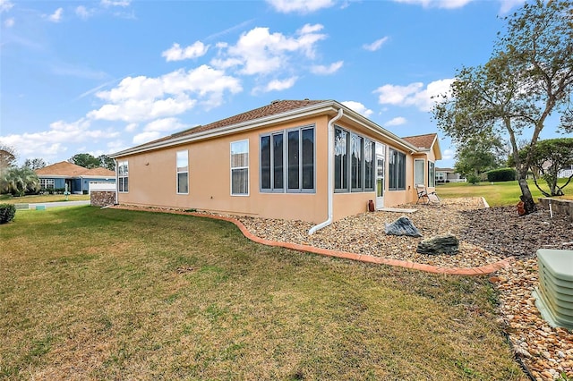 view of side of home featuring a lawn