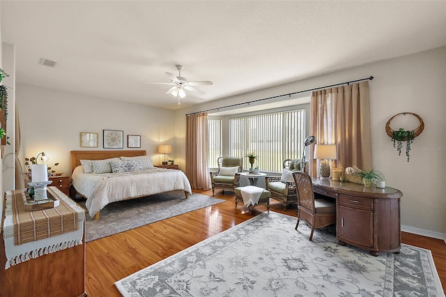 bedroom featuring wood-type flooring and ceiling fan