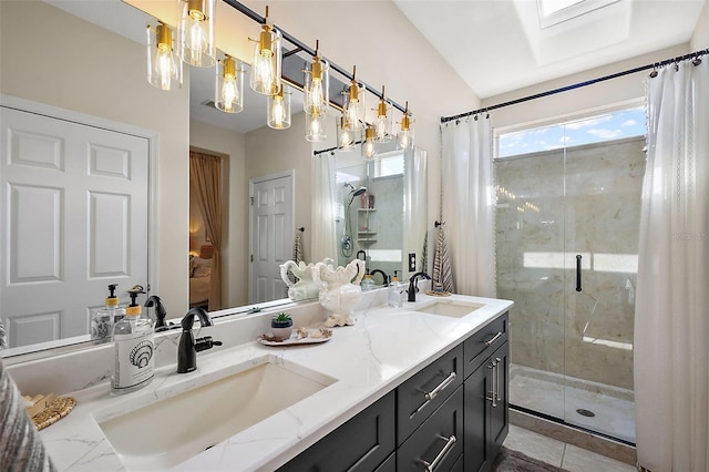 bathroom with an enclosed shower and vanity