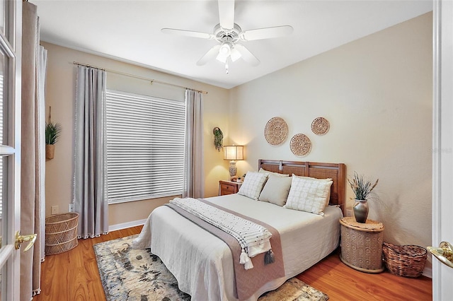 bedroom with light wood finished floors and ceiling fan