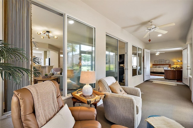 sunroom / solarium featuring ceiling fan