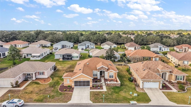 birds eye view of property with a residential view