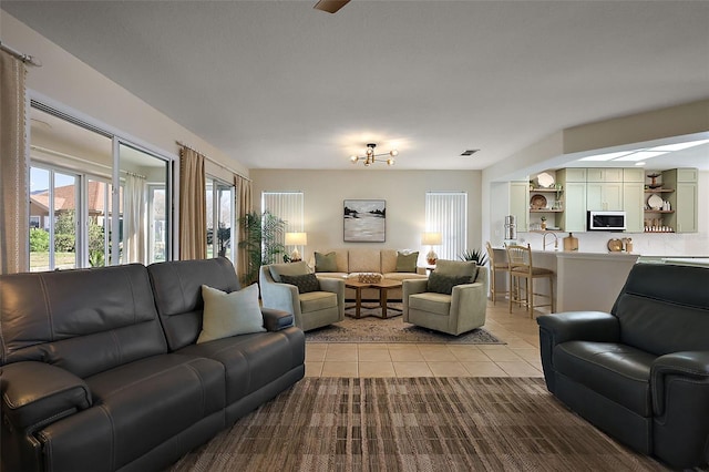 living area with tile patterned floors and visible vents