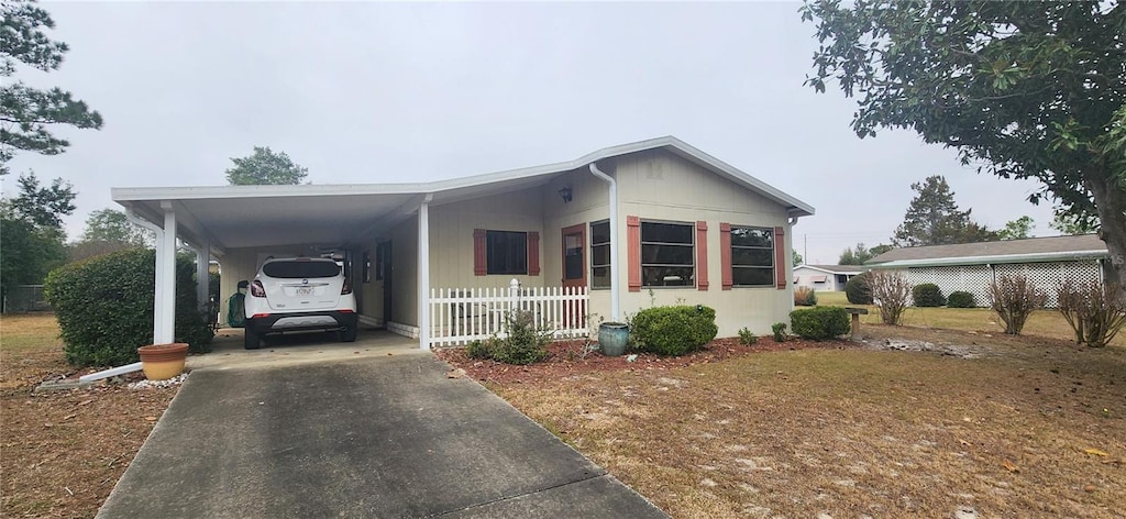 view of front of property with a carport