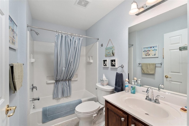 bathroom with toilet, vanity, visible vents, and shower / tub combo with curtain