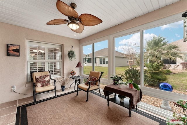 sunroom with a ceiling fan