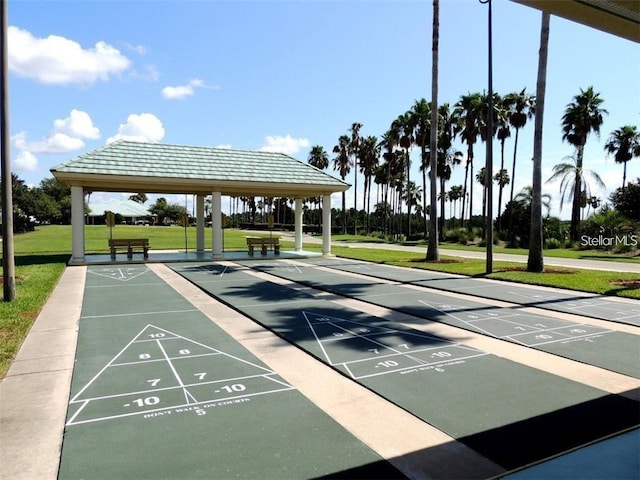 view of community featuring shuffleboard, a yard, and a gazebo