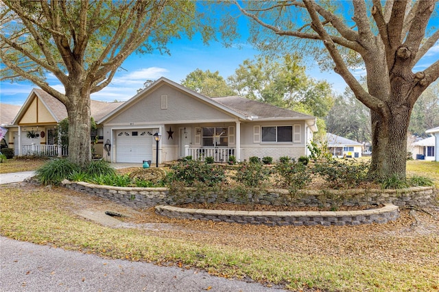 ranch-style home featuring a porch and a garage