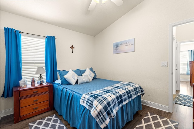 bedroom featuring dark wood-type flooring, ceiling fan, and lofted ceiling